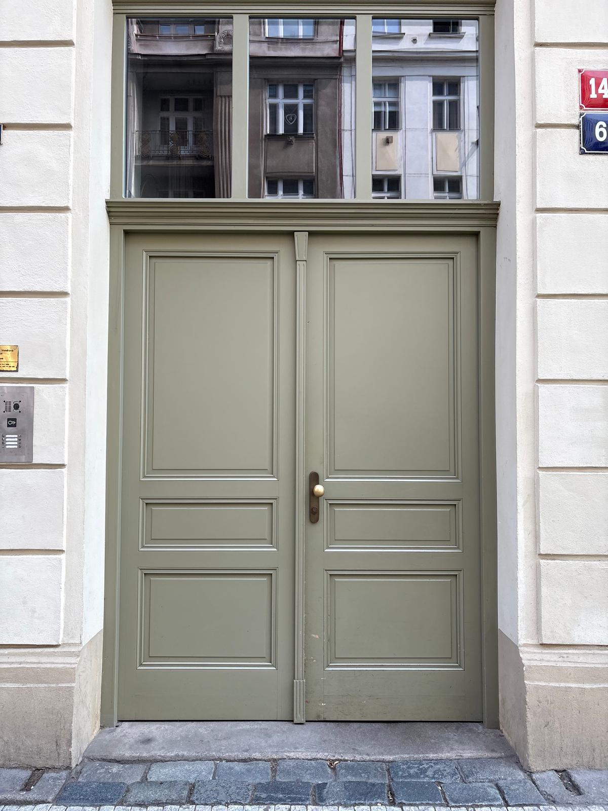 Muted green historic doorway in Prague